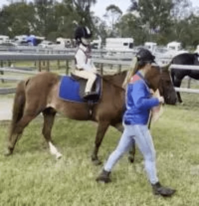 Young rider at the Jimboomba Pony Club event sponsored by Advanced Decking and Patios local talent.webp