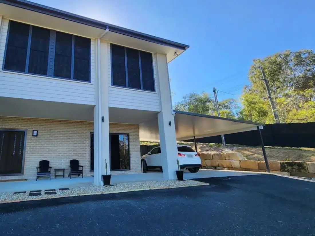 Front view of the new carport and side patio roof on a sloping block